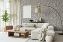 Elegant vardagsrum med grå botanisk tapet